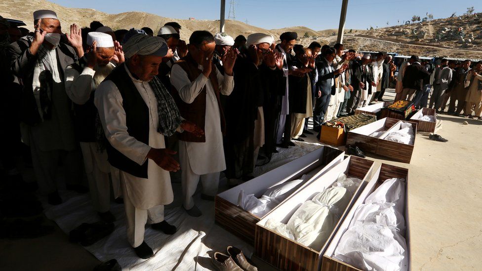 People attend at the funeral of victims after a landmine targeted a mini-bus full of passengers in a Taliban controlled area in Wardak province 40km away from Kabul, Afghanistan, 20 October 2020.
