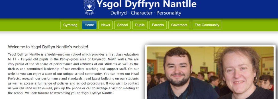 A screenshot of Ysgol Dyffryn Nantlle's website - at the top of the page is a the school's logo and name and it's motto which reads Delfydd (Welsh for ideals), character and personality