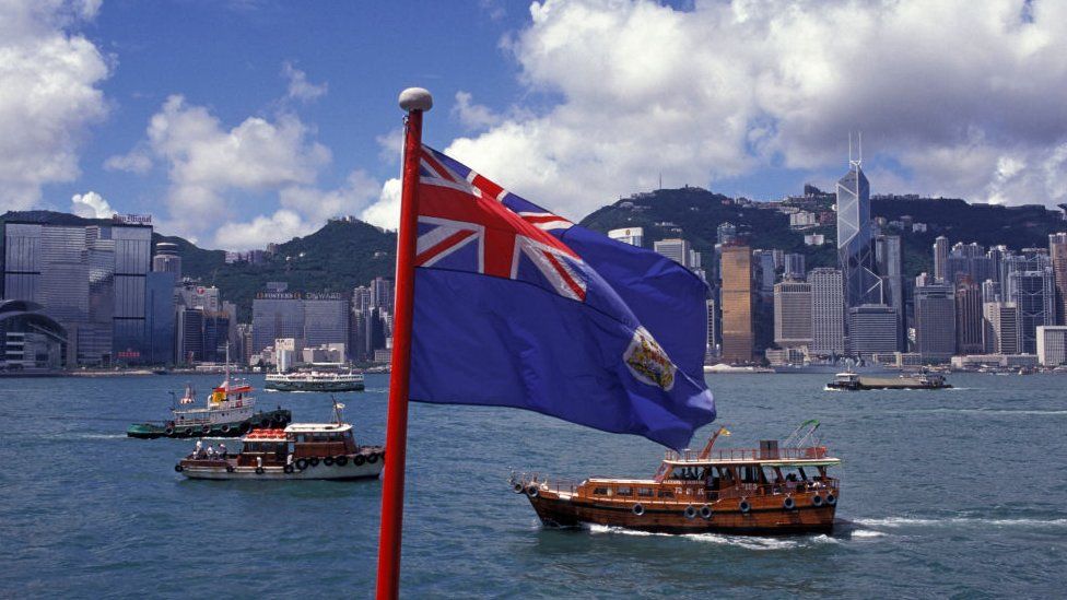 The British Hong Kong flag flies over Hong Kong harbour for the last few hours, on the eve of the handover of sovereignty from Britain to China, on 30th June 1997