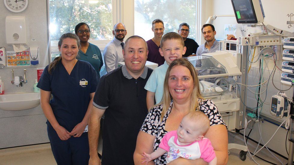 Lacey with parents and the medical team at St George's Hospital