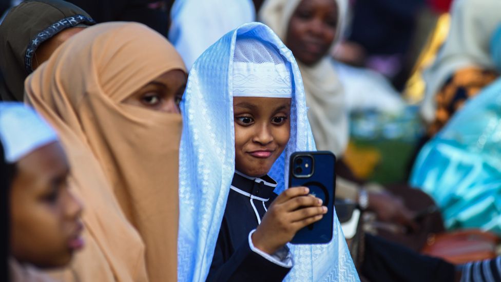 Muslims waiting Eid prayers at a cricket field in Nairobi, Kenya - Wednesday 10 April 2024
