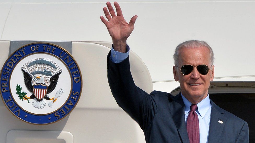 US Vice President Joe Biden waves after landing at the Boryspil airport in Kiev on April 21, 21014
