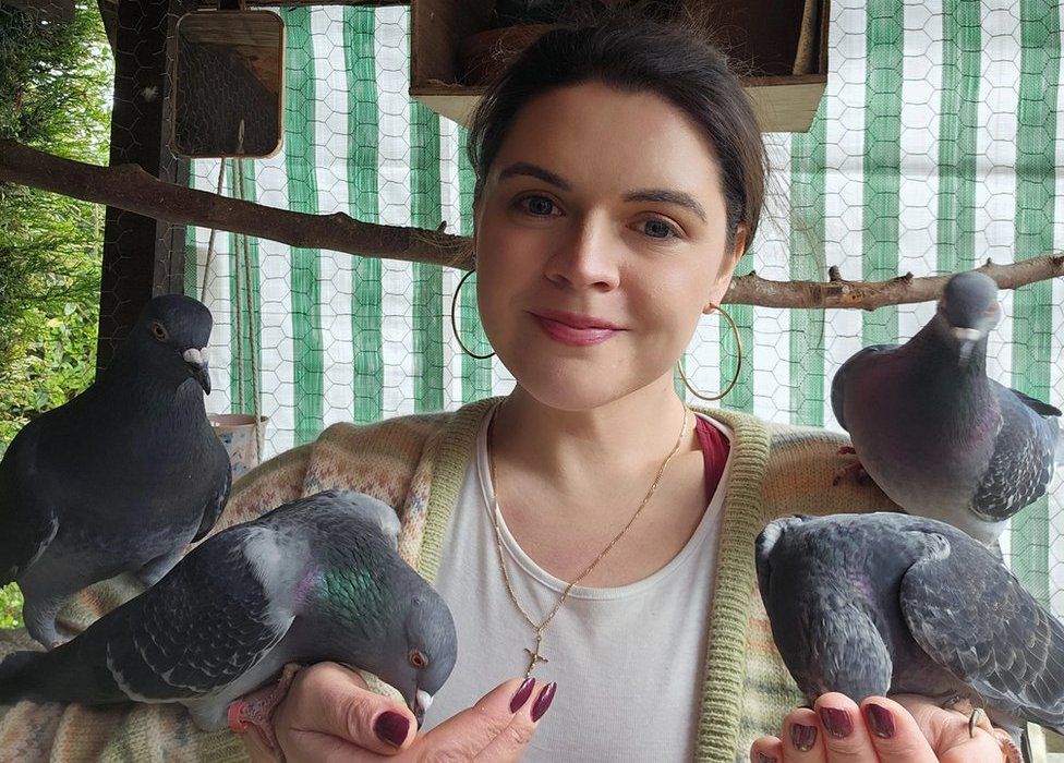 Hannah with five pigeons