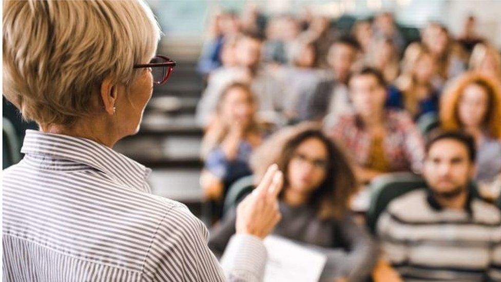 A lecturer in front of a class