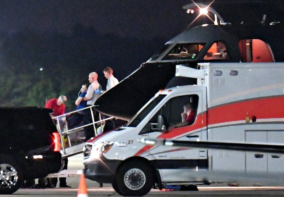 A person believed to be Otto Warmbier is transferred from a medical transport airplane to an awaiting ambulance at Lunken Airport in Cincinnati, Ohio, U.S., 13 June 2017.