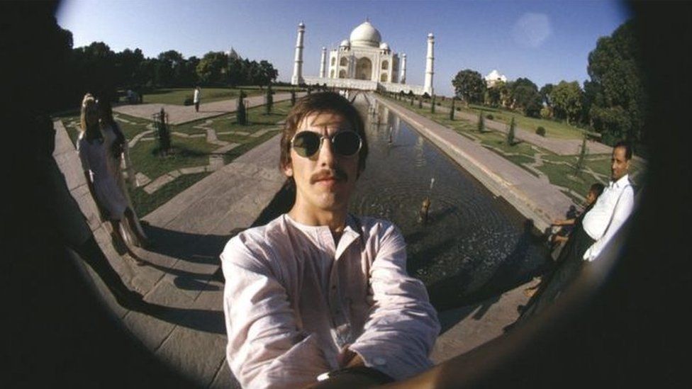 The Beatles lead-guitarist George Harrison takes a selfie in front of the Taj Mahal during his visit to India in 1966