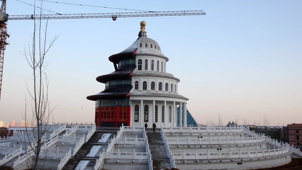 A building that is half black and red coloured Chinese temple and half a white coloured replica of the US Capitol, under construction on 3 December 2015 in Shijiazhuang, Hebei Province of China.