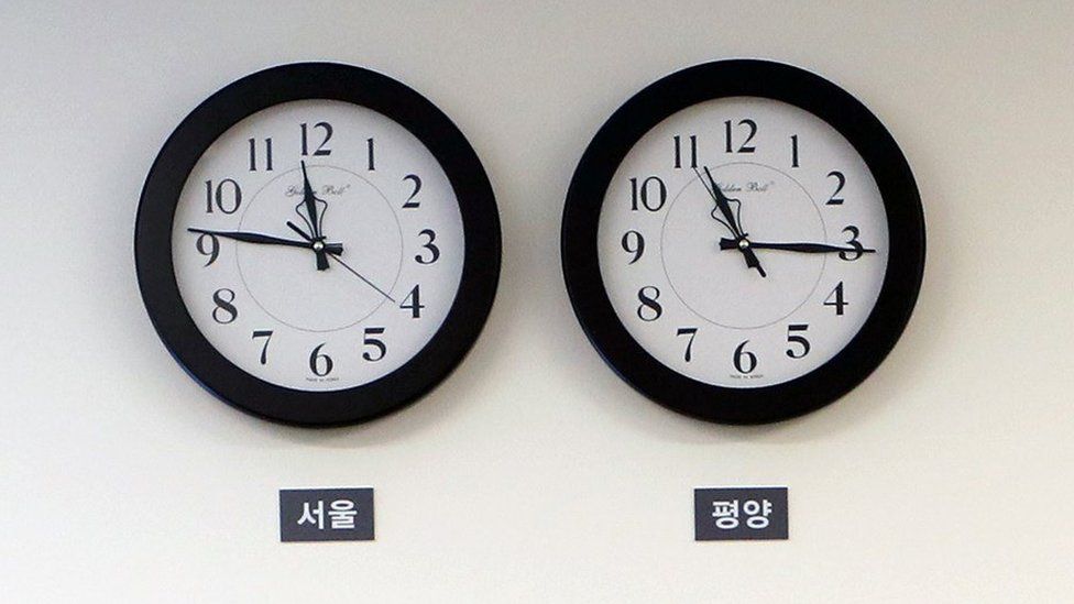 A photo made available by the South Korean Presidential Office shows Seoul time zone clock (L) and Pyongyang time zone clock (R) at the Peace House in the Demilitarized Zone (DMZ), in April 2018