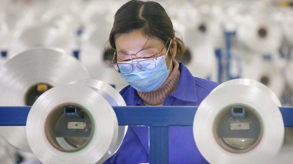 Chinese employee working in factory
