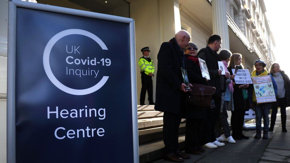 Bereaved families outside the Covid inquiry in London
