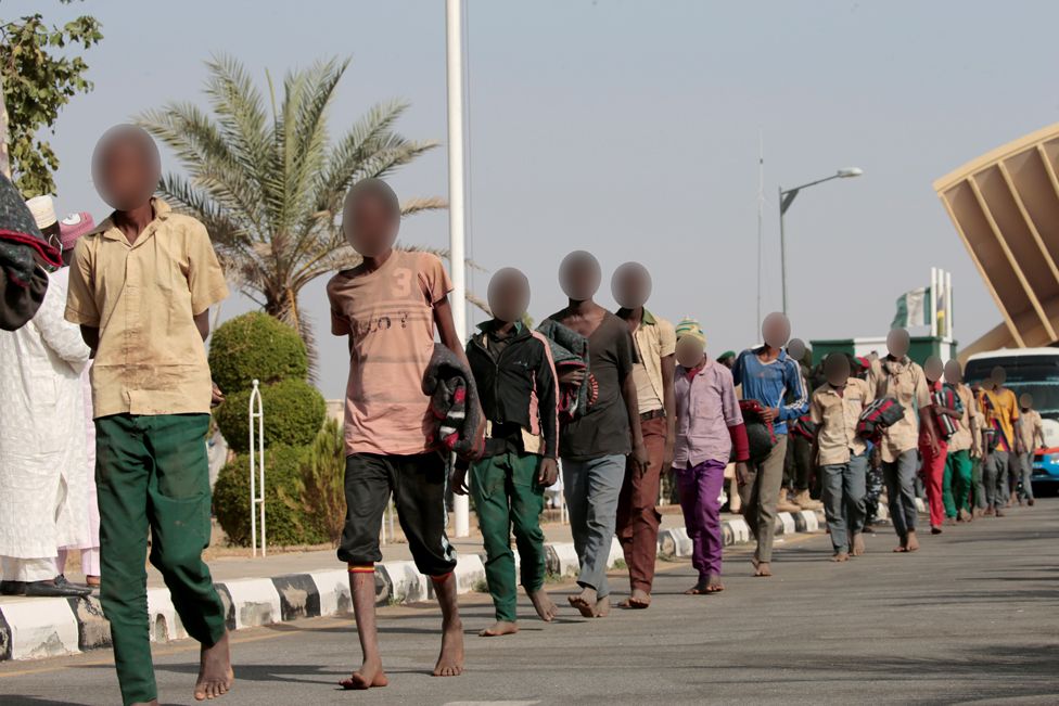 Freed Nigerian schoolboys walk after they were rescued by security forces in Katsina, Nigeria, December 18, 2020.