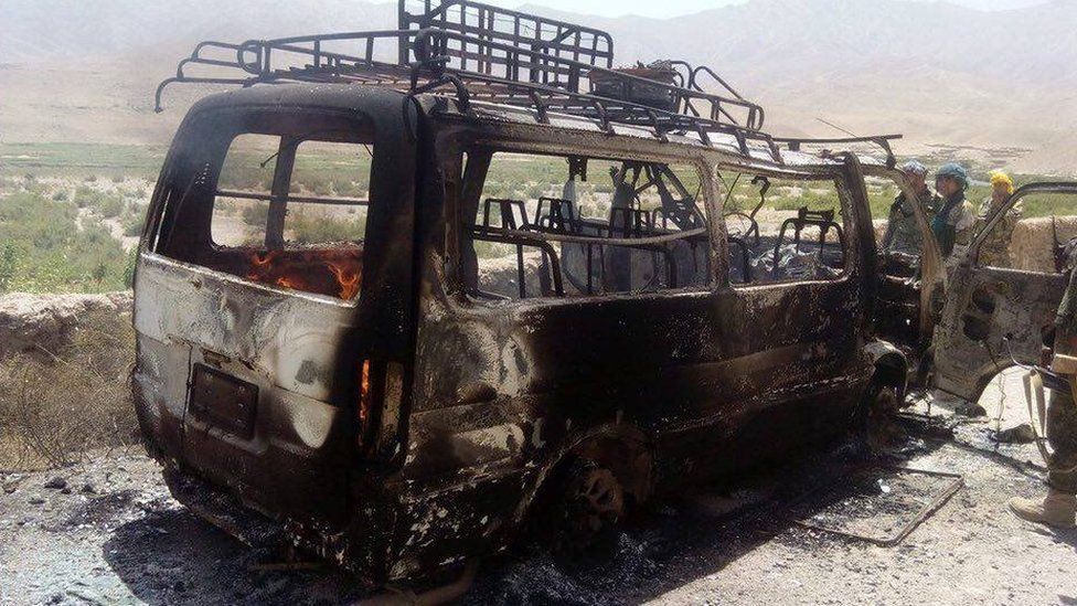 Photo showing burnt out bus in which the tourists were being taken to Herat