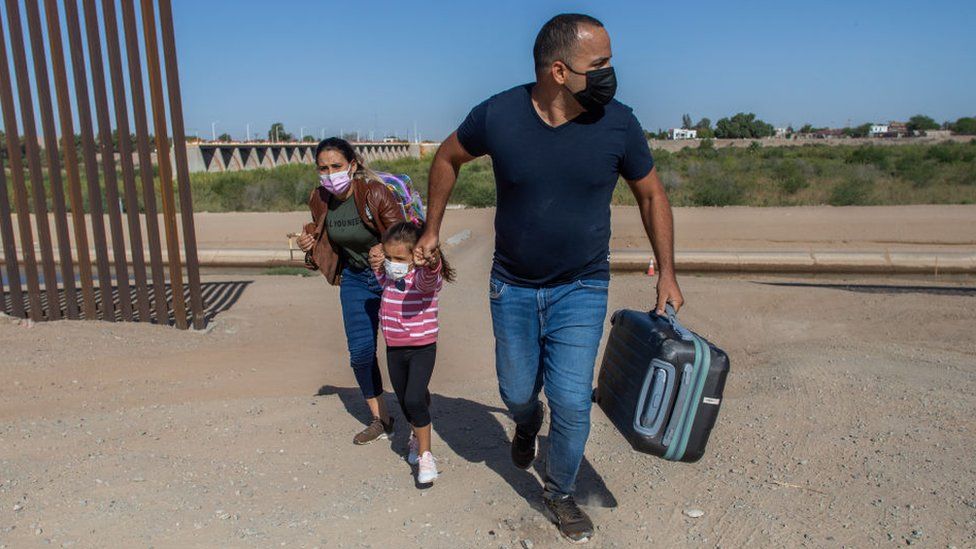 Migrants crossing border