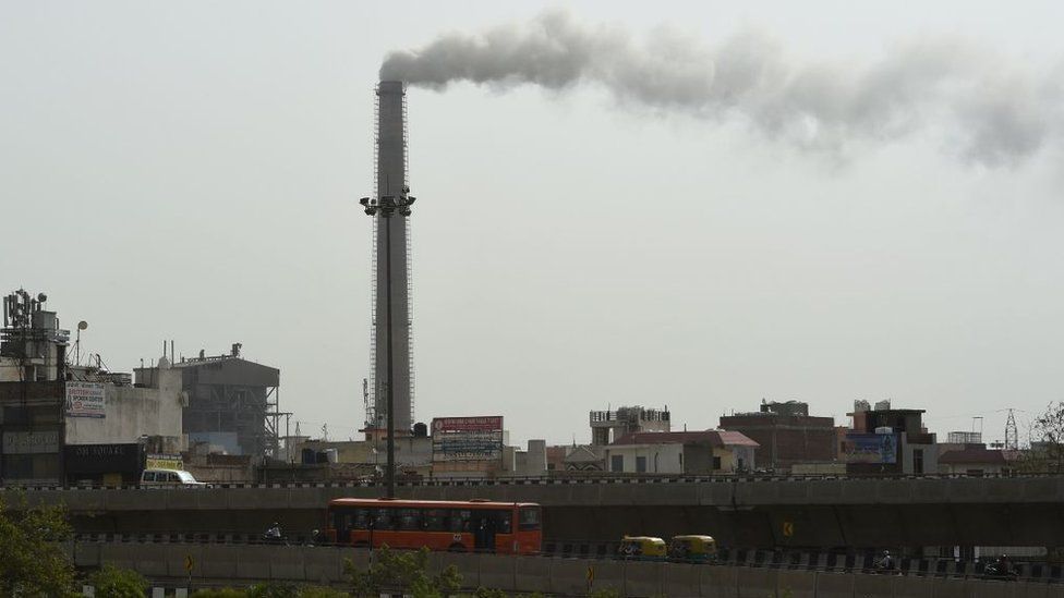 Smoke rises from the Badarpur Thermal Power Station in New Delhi on June 5, 2017, on the United Nation's World Environment Day.