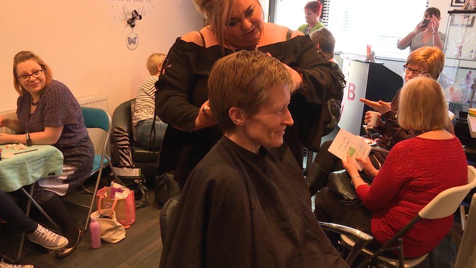 Sharon McFeat, seen here enjoying a haircut, has been coming to the Feel Good Project for four years.