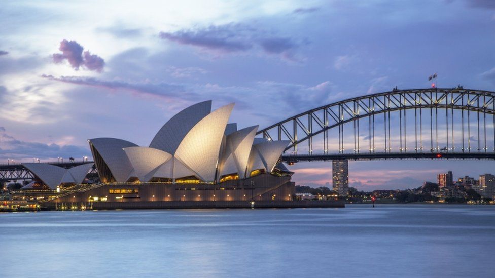 Dusk-time views of the Sydney harbour, including the Opera House and the Sydney Harbour Bridge