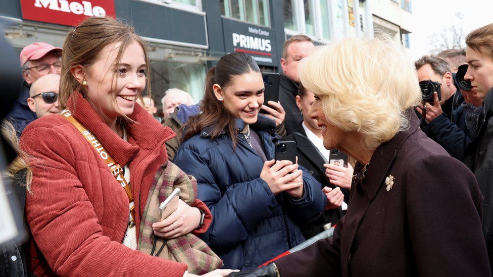 Camilla, the Queen Consort greets a member of the public