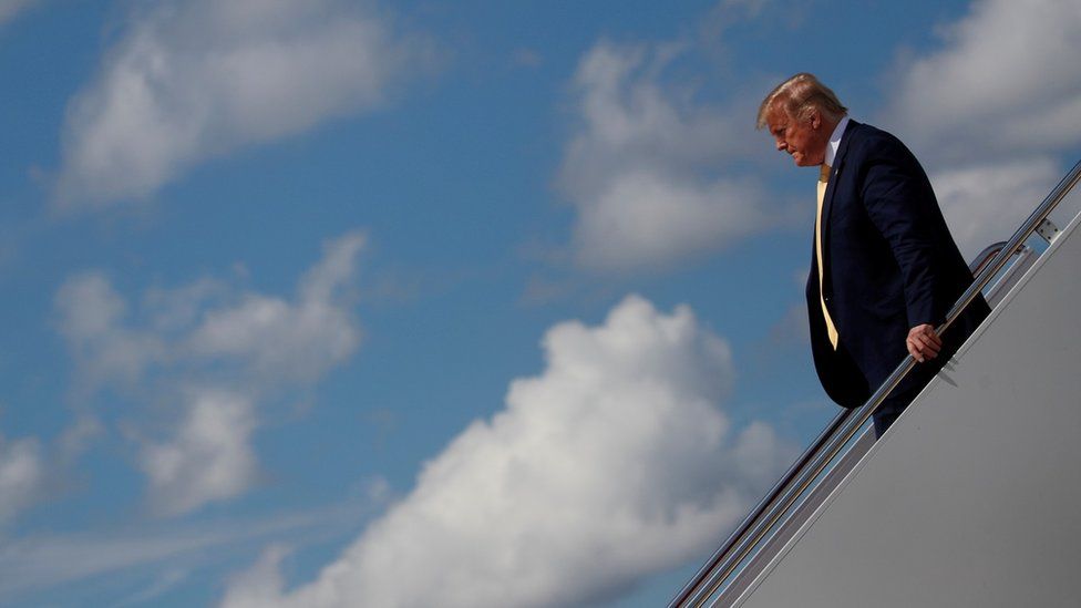 Donald Trump steps off Air Force One as he returns to Washington at Joint Base Andrews, Maryland, on 19 June