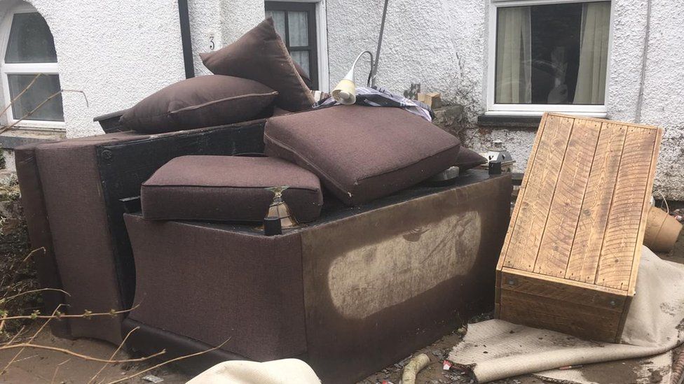 Flood damaged furniture at Llanfair Talhaiarn