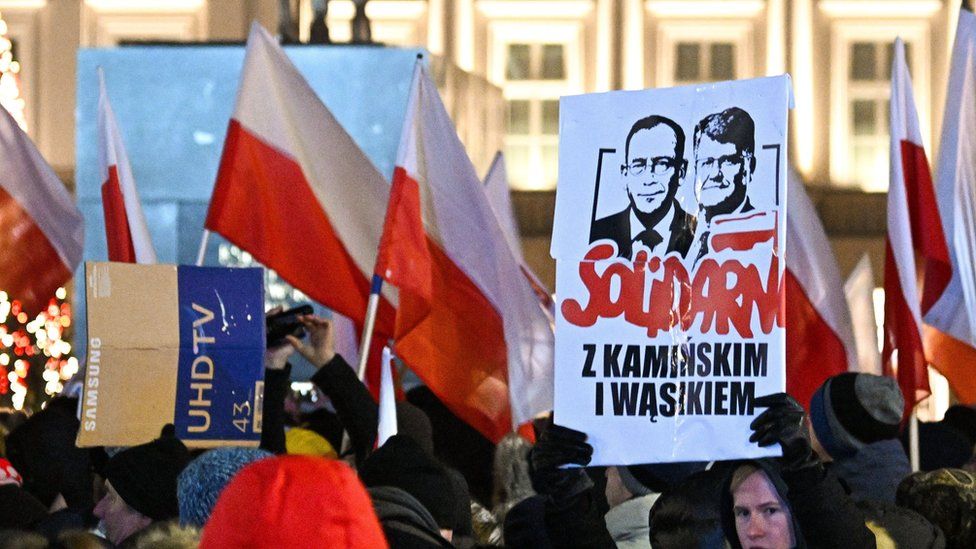 Protesters gather outside the Polish presidential palace