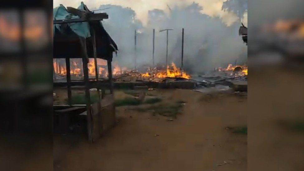 The village of Kuke Mbomo seen on fire