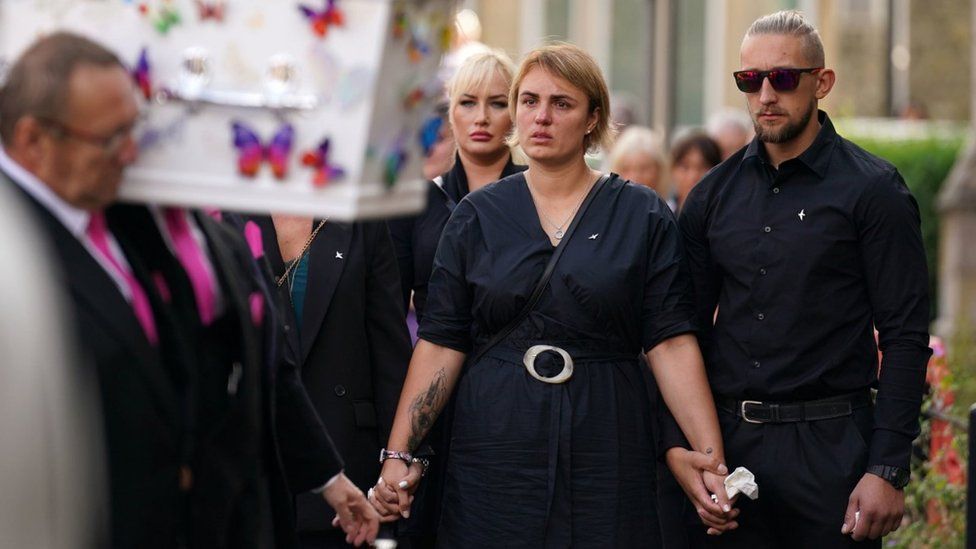 The coffin of nine-year-old stabbing victim Lilia Valutyte being carried into St Botolph's Church followed by her mother Lina Savicke and step-father Aurelijus Savickas