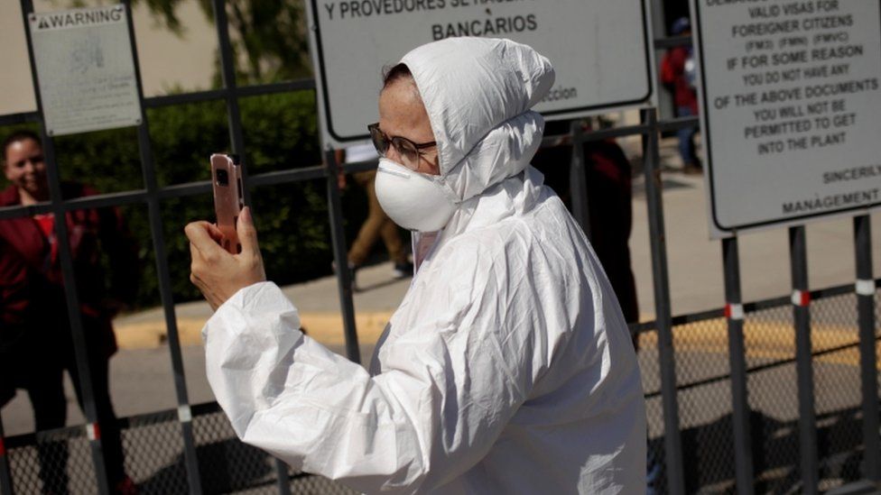 Susana Prieto, a lawyer and labour activist, is seen outside of a factory during a protest