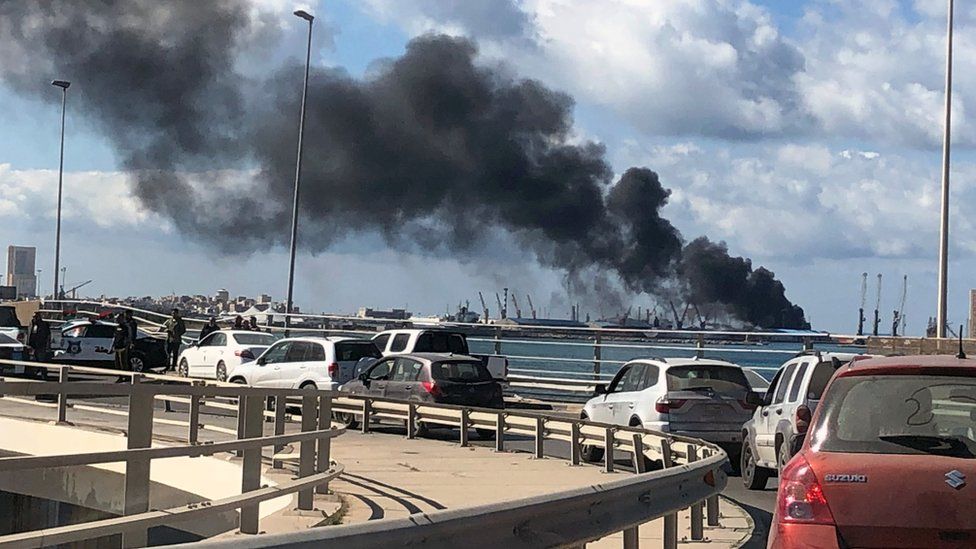 Smoke rises from the port in Tripoli after being attacked in Libya, 18 February 2020