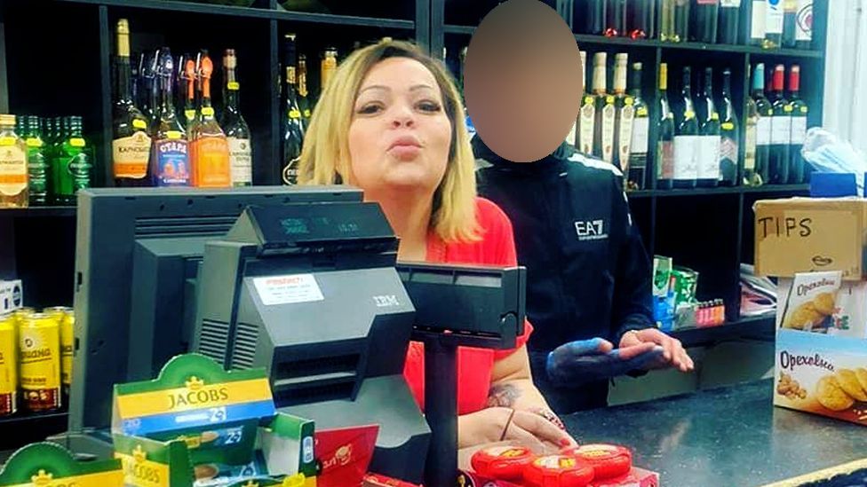 Galina Nikolova, photographed behind the counter at Antonio Food in north London, pouting at the camera with a man in a tracksuit beside her
