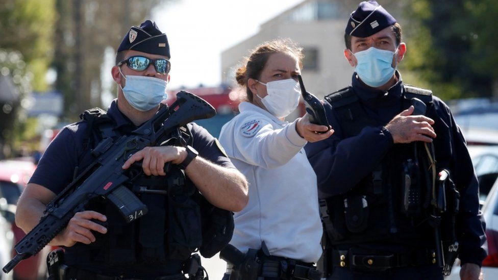 Police officers secure the area where an attacker stabbed a female police administrative worker, in Rambouillet, near Paris, France, April 23,
