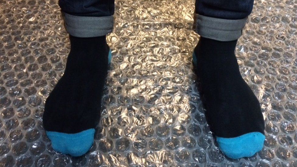 Jumping on bubble wrap is one way of staying happy this Christmas - BBC ...