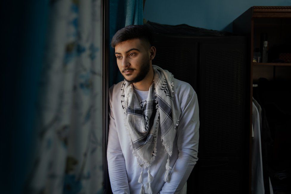 Musa Aloridat in his bedroom in Jericho, where Israeli soldiers fired a bullet into the wardrobe as they raided the house