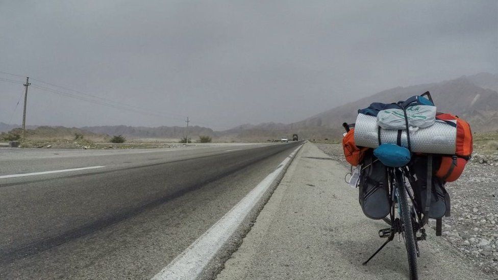 Clifin Francis' bike on a road between Iran and Azerbaijan