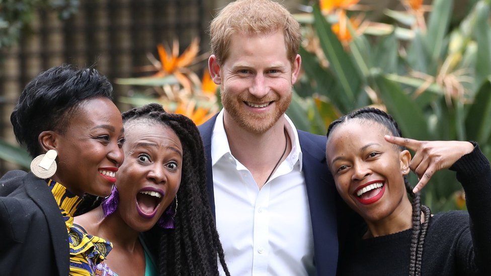 Prince Harry poses with business representatives at a Creative Industries and Business Reception, at the British High Commissioner's residence