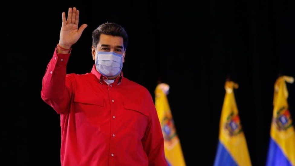 Handout photo made available by the Miraflores press shows president of Venezuela, Nicolas Maduro, during a ceremony with the governors and pro-government mayors, in Caracas, Venezuela, 29 December 2020.