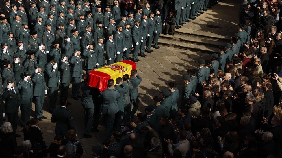 Guardia Civil officers carry the coffin of their colleague David Perez Carracedo in Pamplona, northern Spain