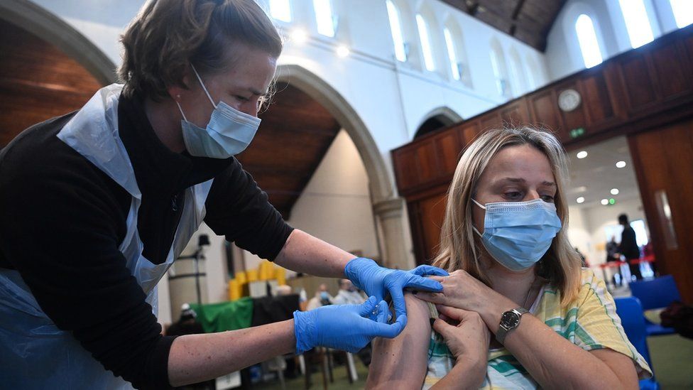 A person is given a Covid vaccine