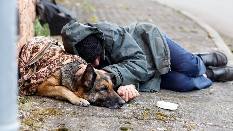 Homeless man with dog