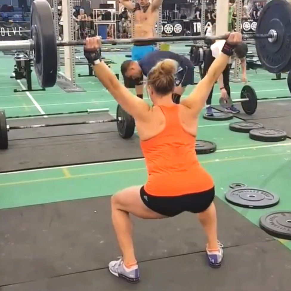 Molly Williams squatting with heavy weights
