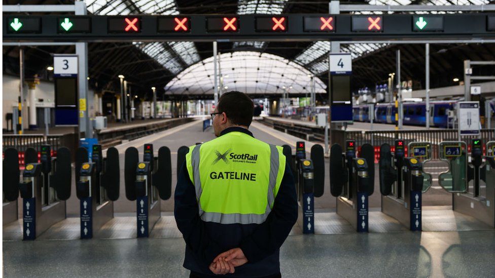 Members of the public make their way through Queen Street station