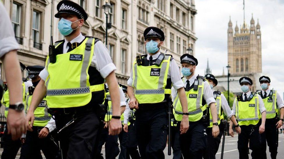 Police officers wearing face masks