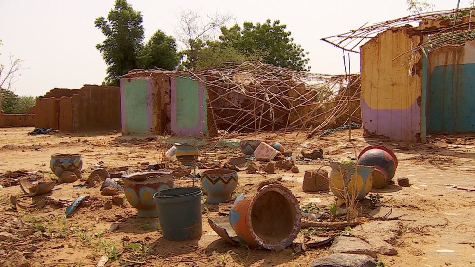 Destroyed homes in Krinding settlement