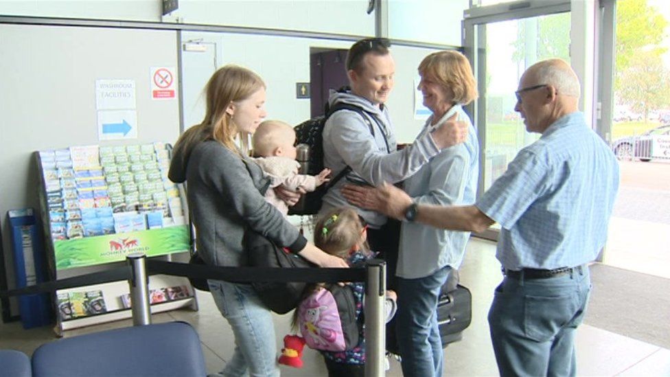 The Vashchynski family arriving in the UK