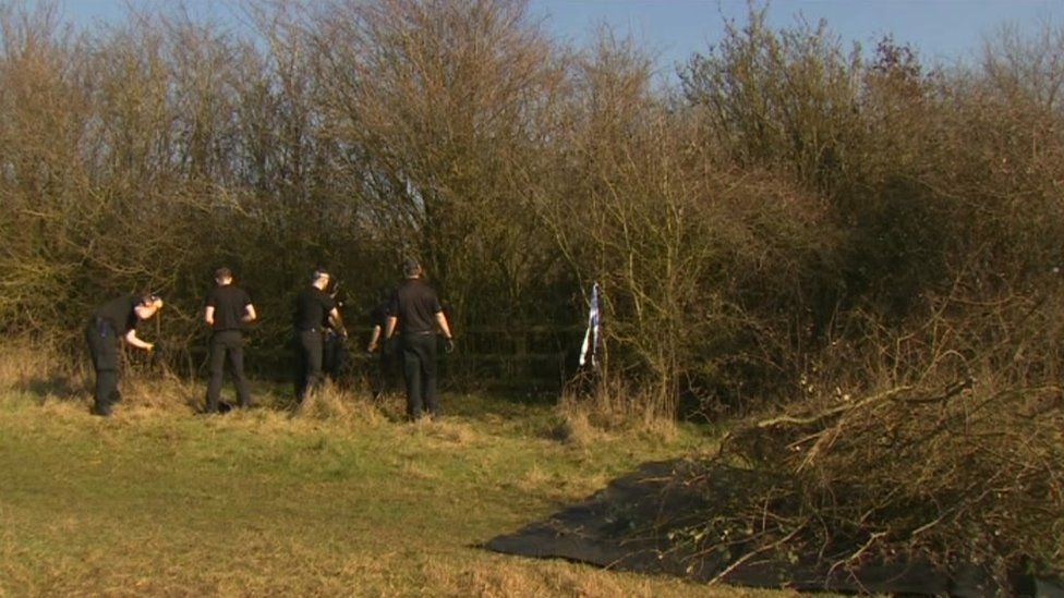 Police searching bushes
