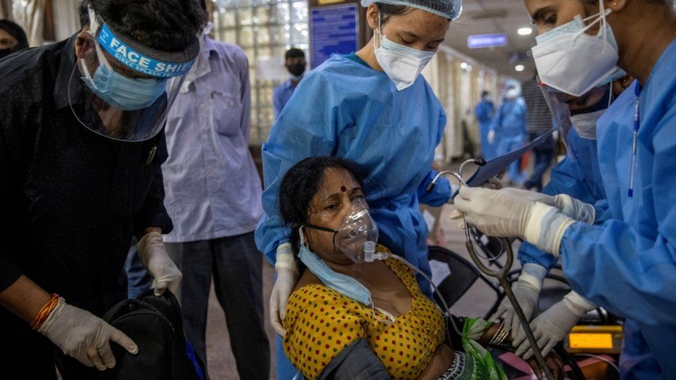 A patient suffering from the coronavirus disease Covid-19 receives treatment inside the emergency ward at Holy Family hospital in New Delhi