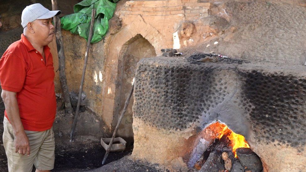 charcoal maker at his stove