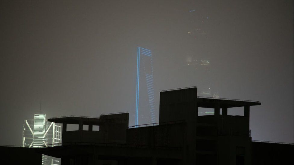 Outline of Shanghai World Financial Centre and Jin Mao Tower in Pudong district during a sandstorm.