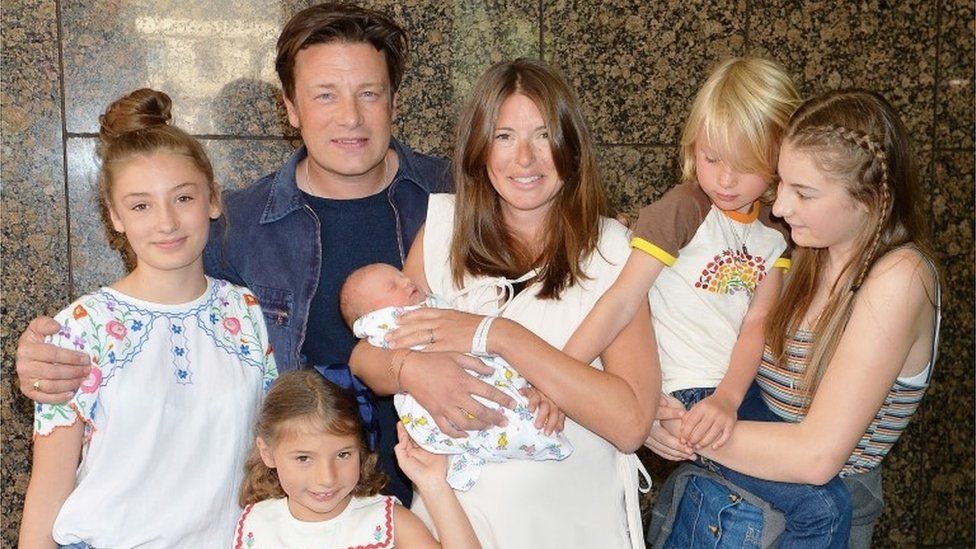 Jamie and Jools Oliver with their five children outside hospital