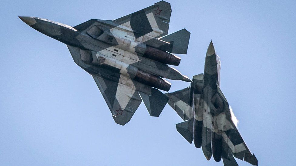 A pair of Russian Su-34 military jets take part in an exhibition flight on July 18, 2017 at the annual air show MAKS 2017 in Zhukovsky, some 40 km outside Moscow