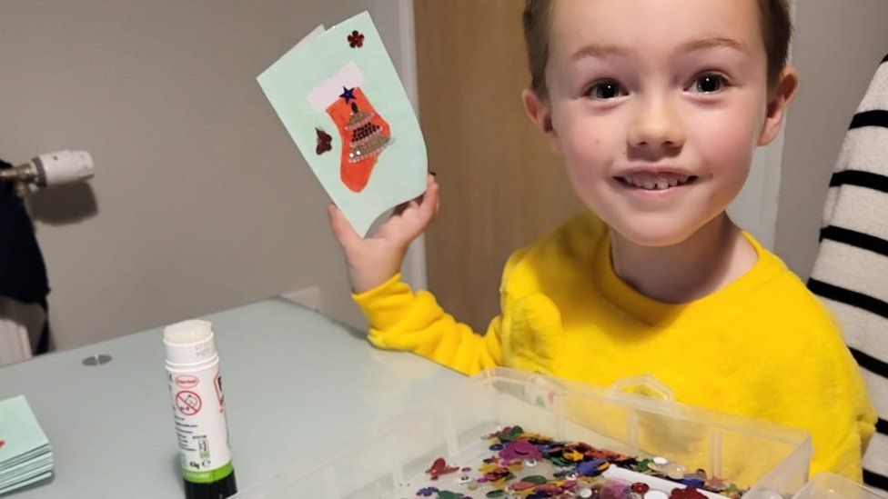 Joshua making cards